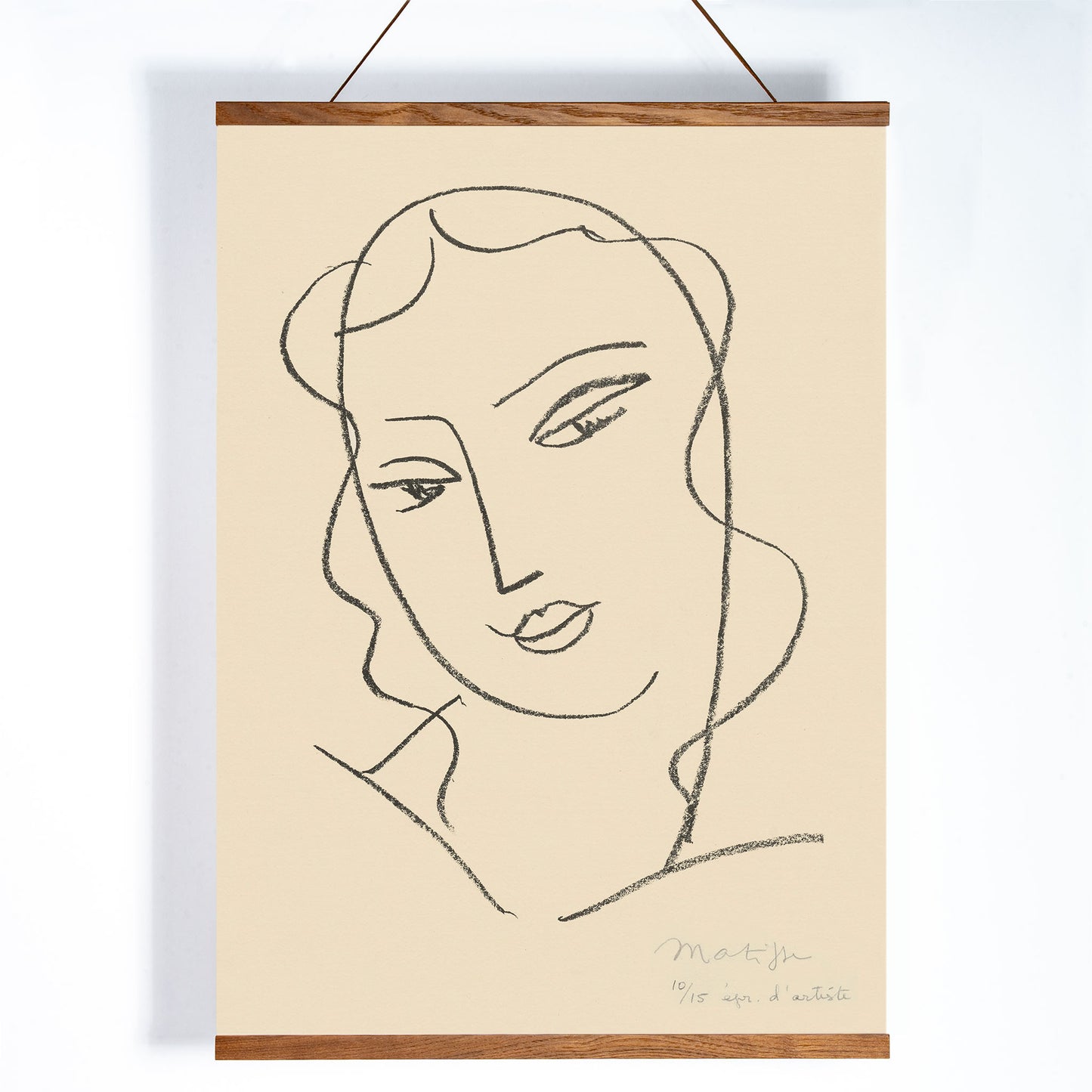 Henri Matisse Veiled Head poster with minimalist veiled face in black linework on a warm pale background, with wooden magnetic frame on white background