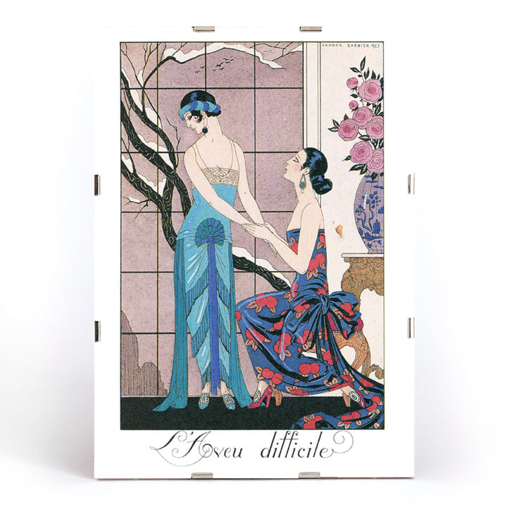 Art deco poster Laveu Difficile by George Barbier featuring two elegant women in colorful dresses in an interior setting, framed and displayed in modern living room decor