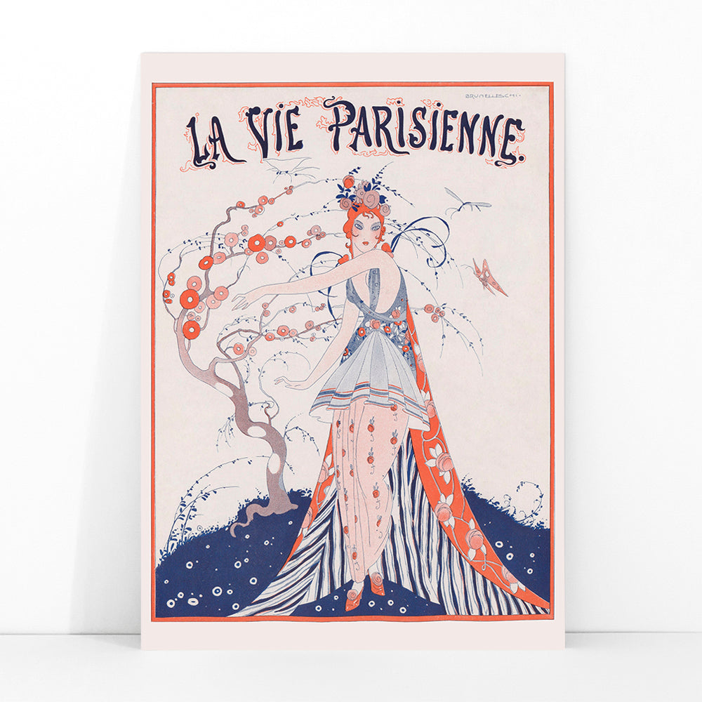 Elegant Art Deco poster of a woman in a floral dress standing by a blossoming tree La Vie Parisienne by Umberto Brunelleschi, framed and displayed in modern living room decor