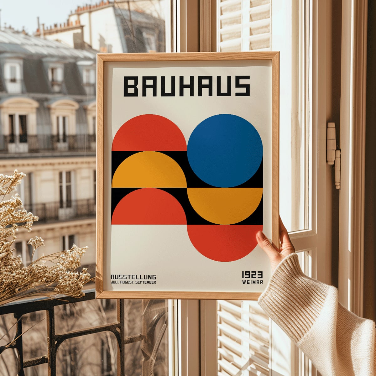 Bauhaus Poster 18 with bold geometric shapes in red blue and yellow on a white background minimalist design primary colors and Bauhaus text at the top, framed and displayed in modern living room decor