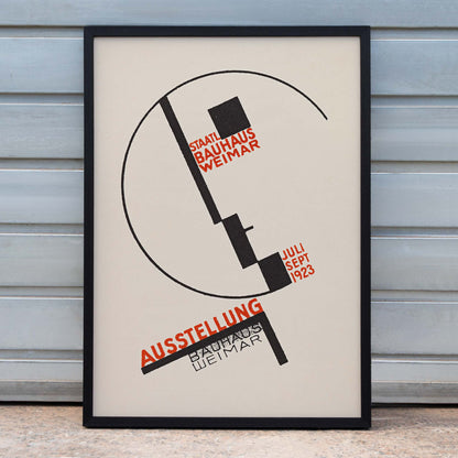 Dörte Helm Bauhaus Weimar exhibition poster with bold black geometry and red typography on warm beige background, framed and displayed in home decor
