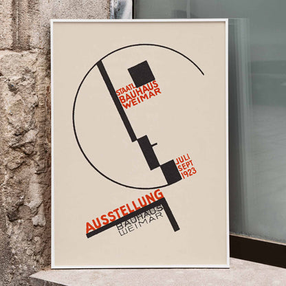 Dörte Helm Bauhaus Weimar exhibition poster with bold black geometry and red typography on warm beige background, framed and displayed in modern living room decor