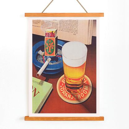 Beer glass on Oranjeboom coaster with cigarette in ashtray and matchbox still life by Bernd Steiner and Anonymous, with wooden magnetic frame on white background