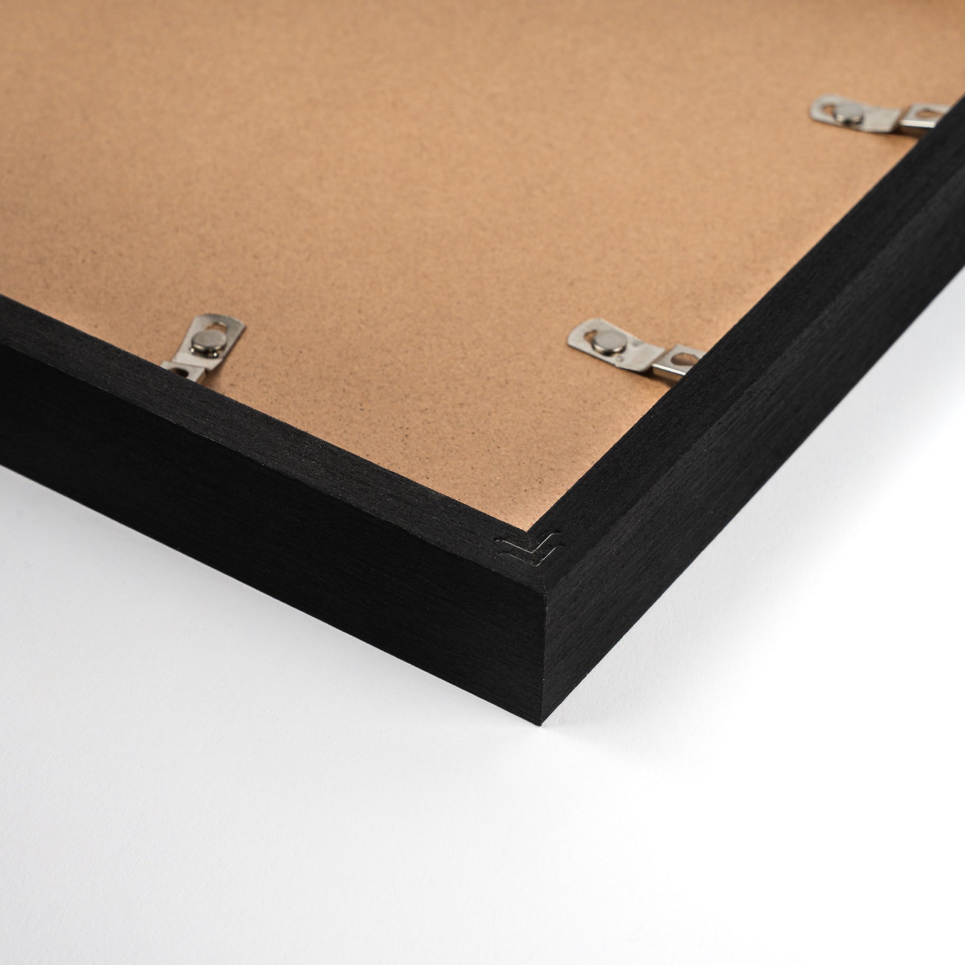 Black pine wood photo frame with elegant black finish, showcasing a classic and refined design suitable for displaying photos or artwork in home or office settings, back corner closeup picture