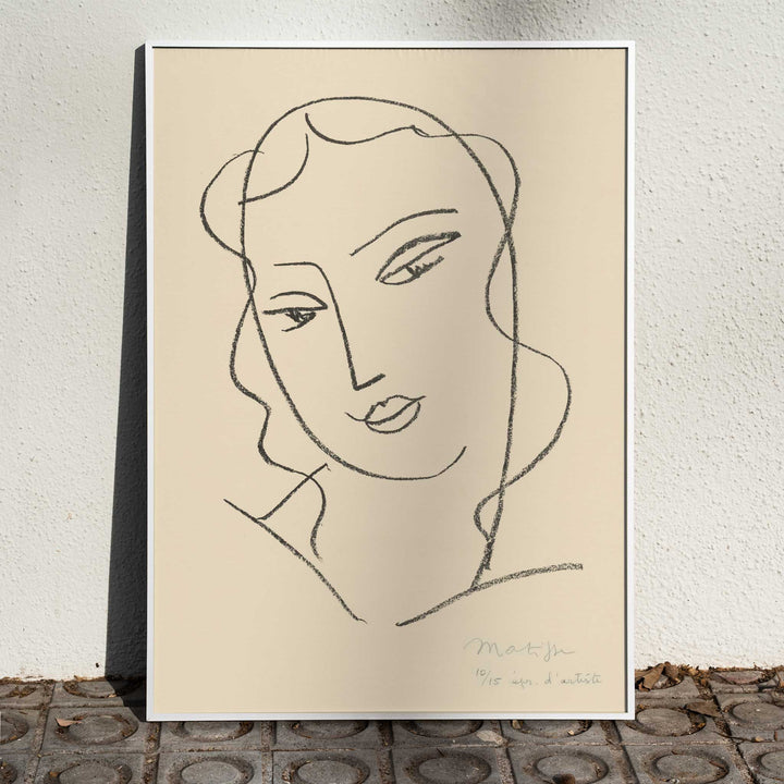 Henri Matisse Veiled Head poster with minimalist veiled face in black linework on a warm pale background, framed and displayed in home decor