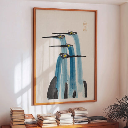 Watercolor painting of three blue cranes titled Blue Japanese Crane by Ohara Koson and Anonymous poster, framed and displayed in home decor