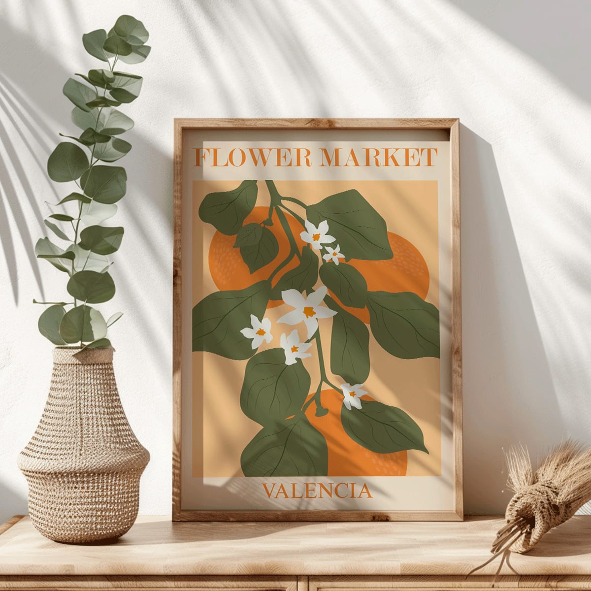 Flower Market Valencia by Moryarty poster illustration with green leaves and white flowers on orange background, framed and displayed in modern living room decor