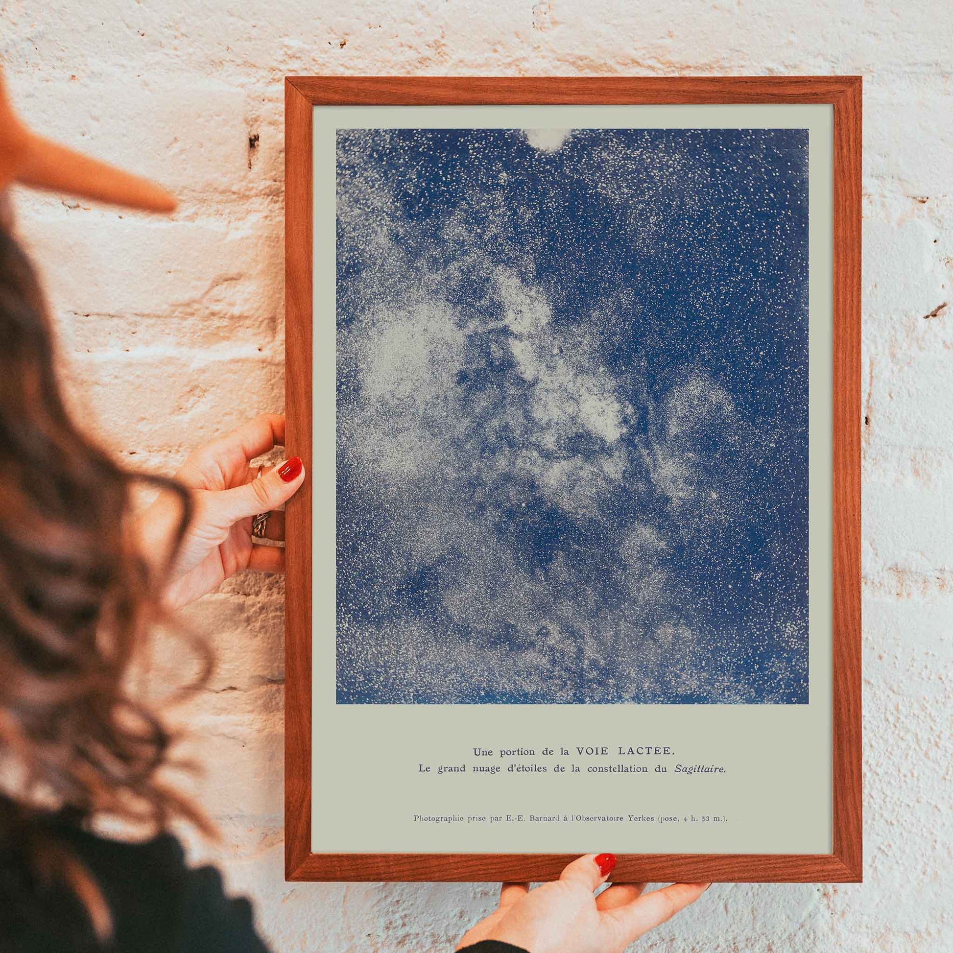 Lucien Rudaux A Portion of the Milky Way poster with luminous star cloud in Sagittarius and deep blue galactic dust, framed and displayed in modern living room decor
