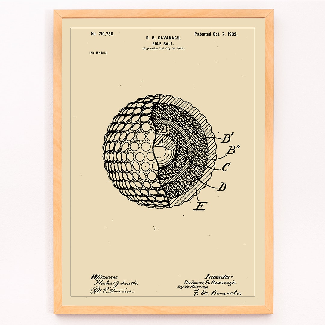 Golf ball patent technical drawing by R B Cavanagh showing detailed labeled interior structure and design elements, framed and displayed in modern living room decor