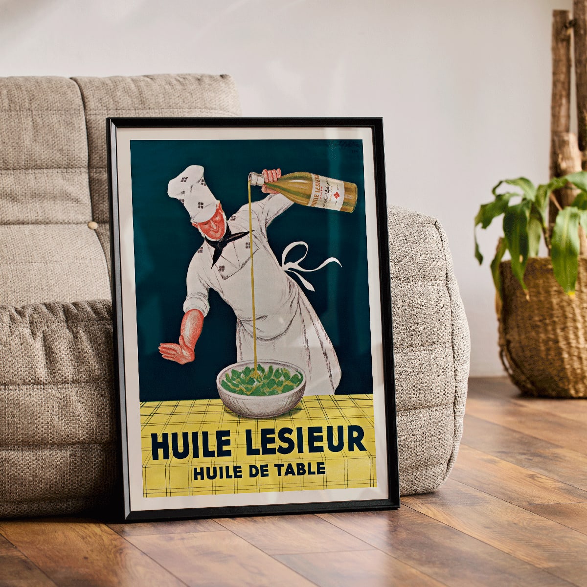 Chef pouring oil into salad Huile Lesieur poster by Leonetto Cappiello, framed and displayed in modern living room decor