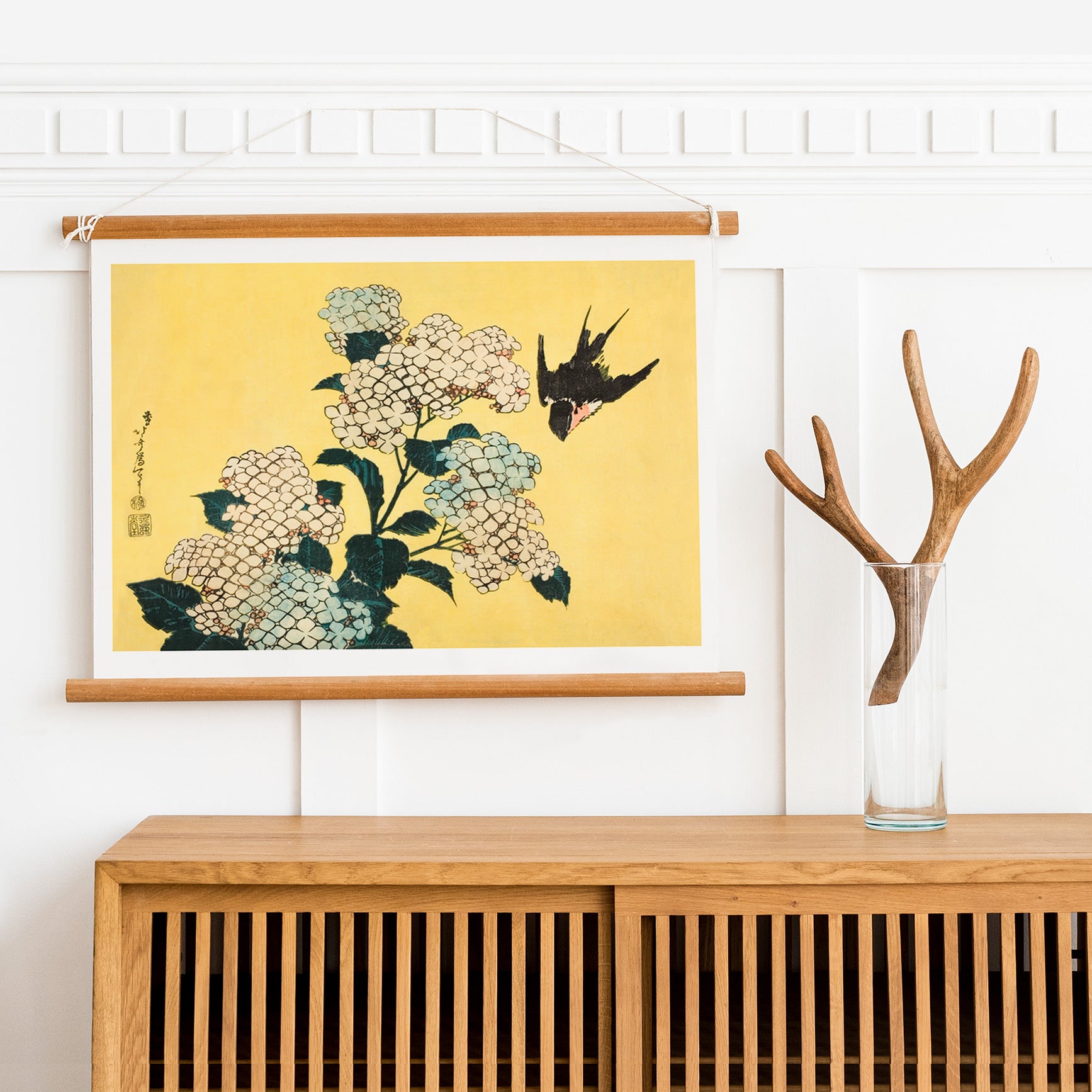 Swallow bird flying near blooming hydrangea flowers artwork by Katsushika Hokusai titled Hydrangea and Swallow on yellow background, framed and displayed in home decor