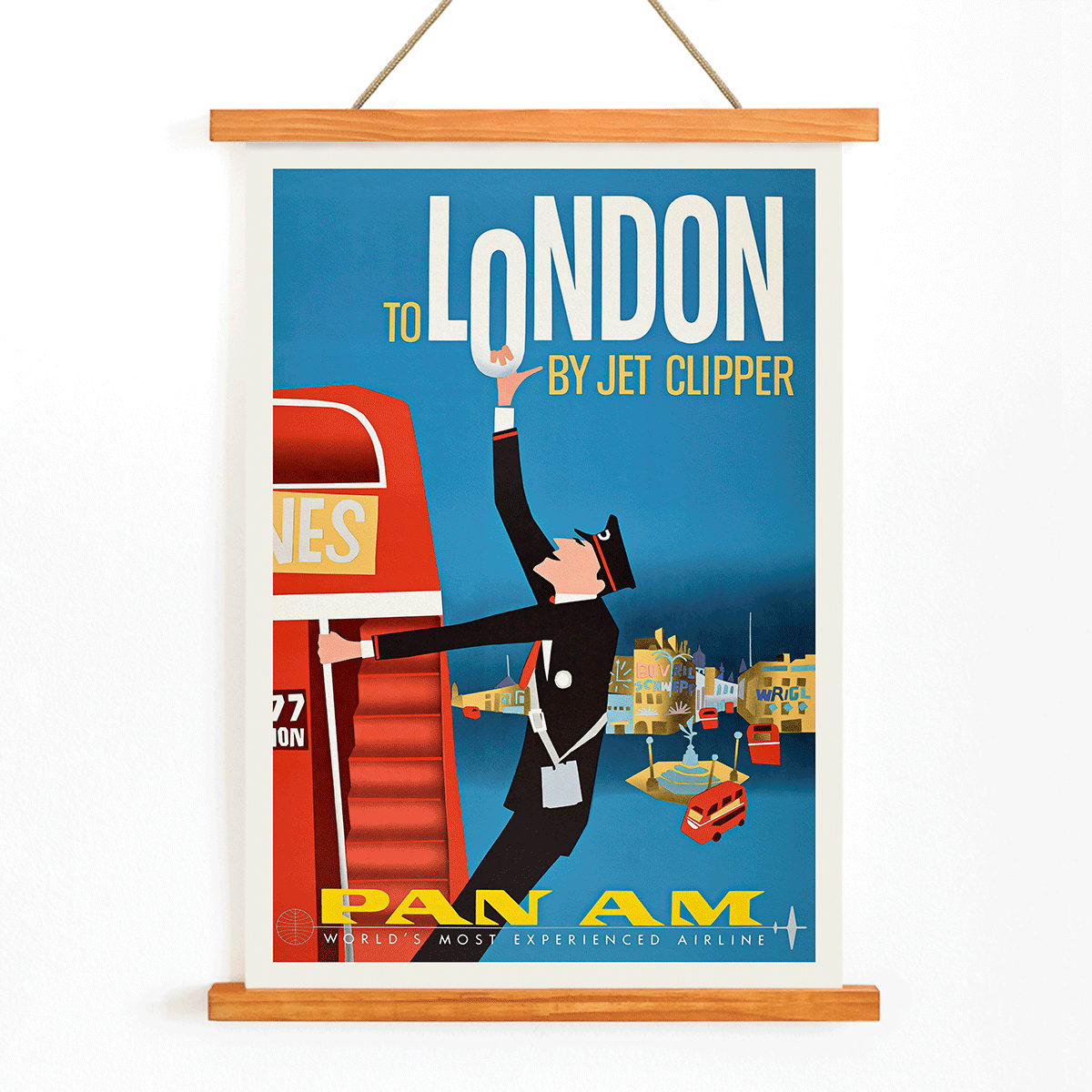 Vintage Pan Am Airlines poster artwork featuring a flight attendant and double decker bus promoting travel to London by Jet Clipper, with wooden magnetic frame on white background