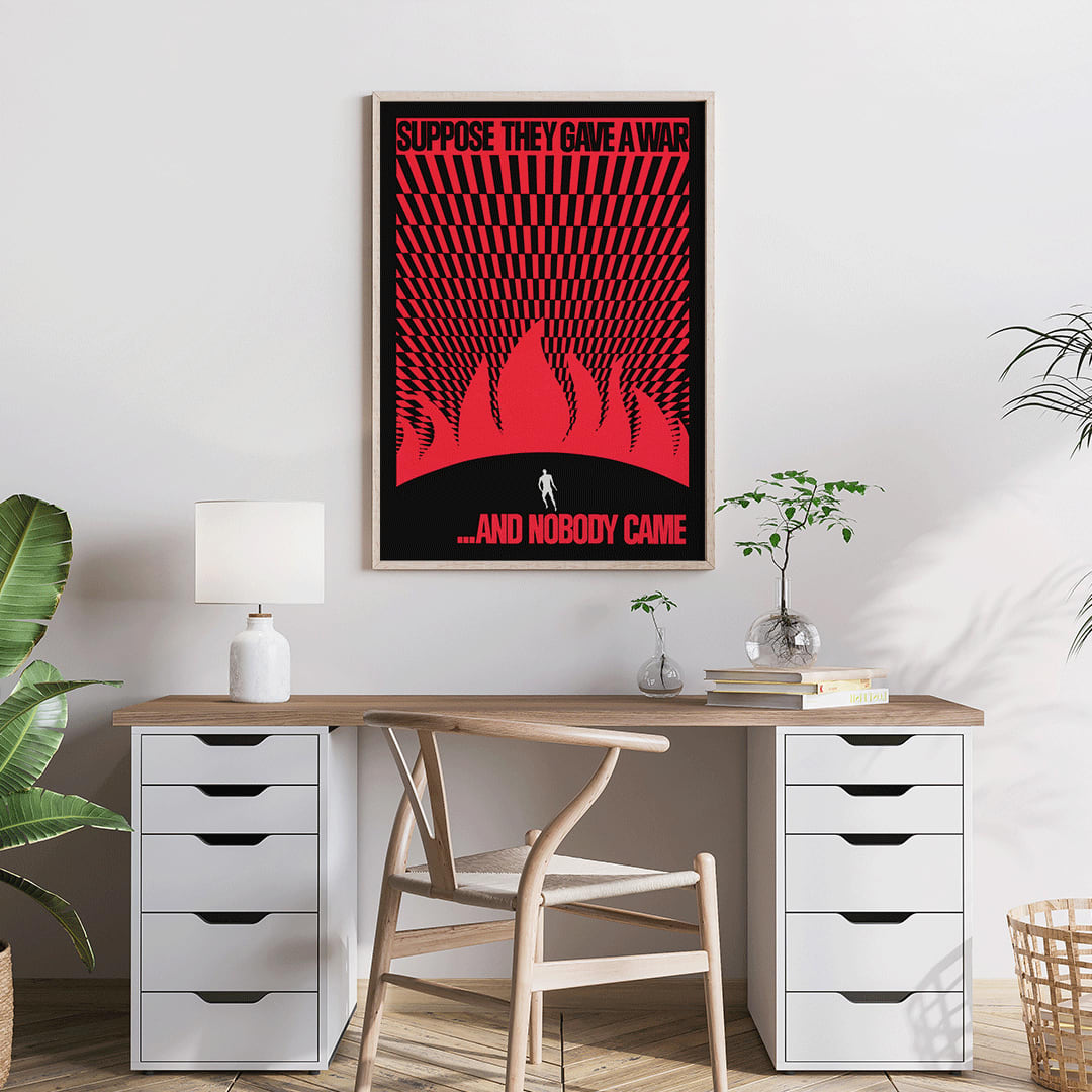 Man on hill facing flames poster by Gary Yanker titled Suppose They Gave a War and Nobody Came Prop art New York, framed and displayed in home decor