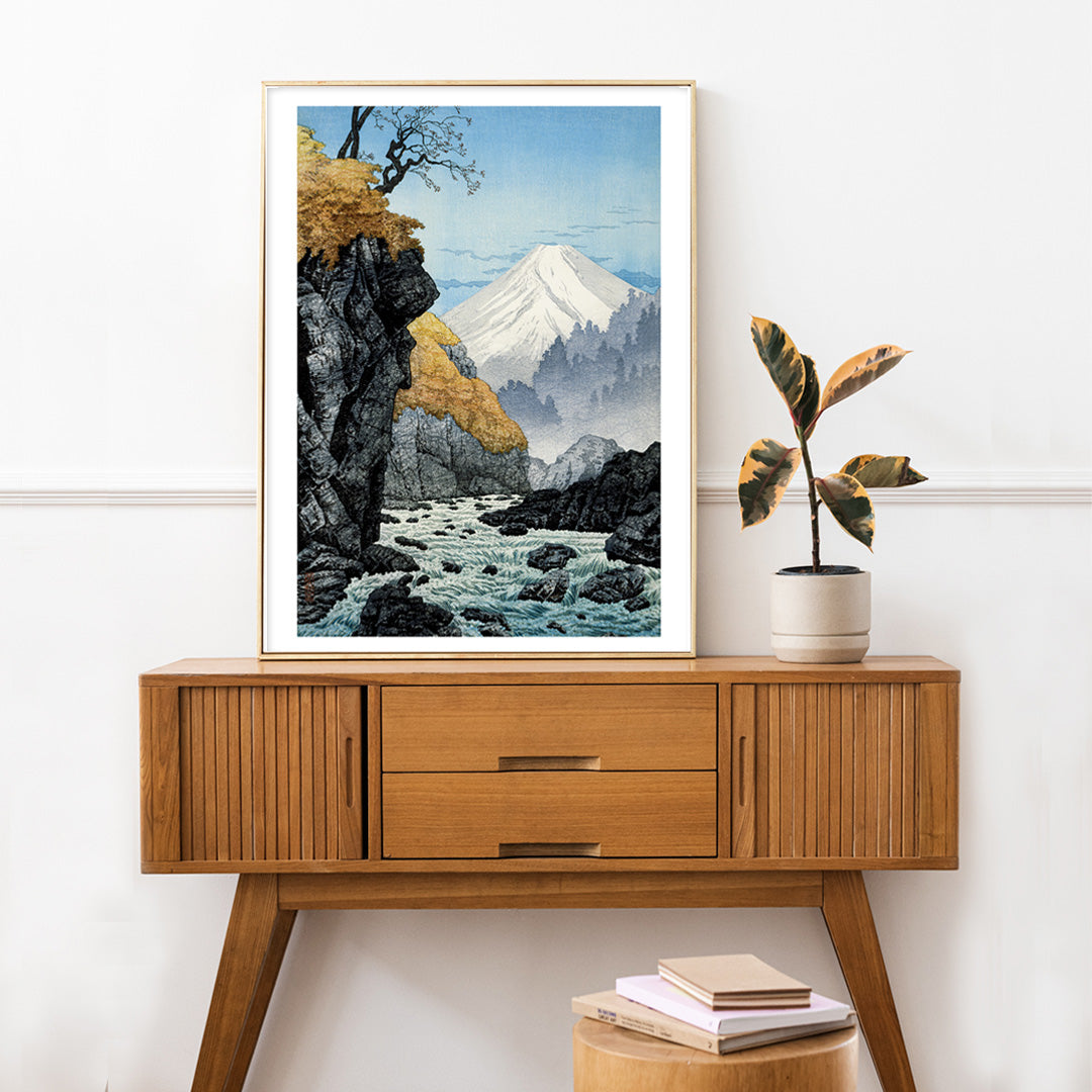 Mountain landscape with river autumn trees and rocky cliffs at Foot of Mount Ashitaka by Hiroaki Takahashi poster, framed and displayed in home decor