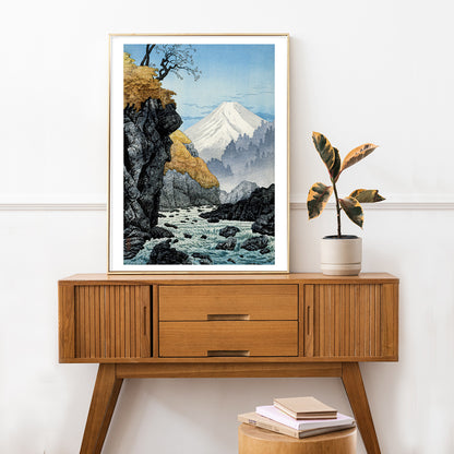 Mountain landscape with river autumn trees and rocky cliffs at Foot of Mount Ashitaka by Hiroaki Takahashi poster, framed and displayed in home decor