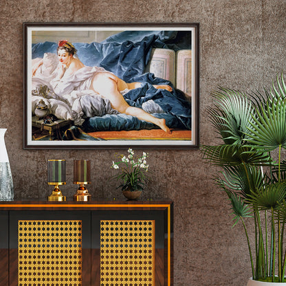 Brown Odalisque by Francois Boucher poster featuring a reclining nude woman on luxurious blue and white fabrics, framed and displayed in home decor
