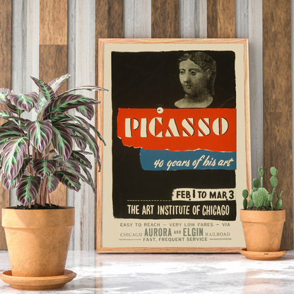 Vintage exhibition poster for Picasso 40 years of his art at Art Institute of Chicago featuring classical sculpture bold graphic text and sculpted head artwork, framed and displayed in home decor