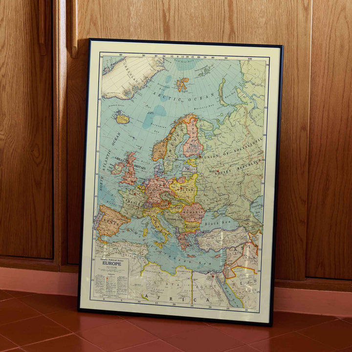 Rand McNally and Company Political Map of Europe poster with detailed continental map, colored borders, seas, and vintage cartographic typography, with wooden magnetic frame on white background