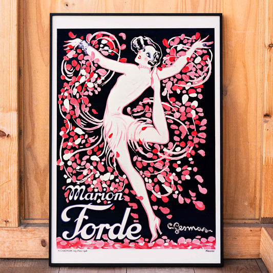 Art Deco poster of Marion Forde by Charles Gesmar featuring a dancer in a pink dress surrounded by vibrant swirling petals, framed and displayed in home decor
