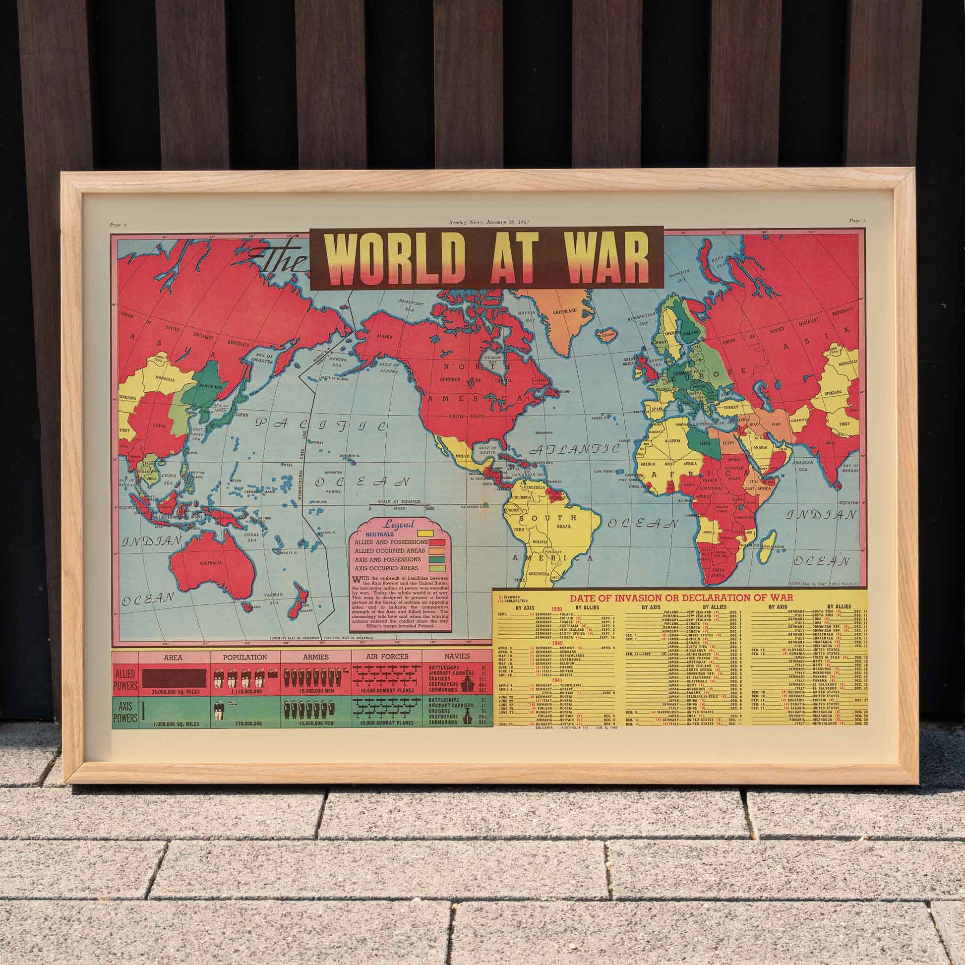 World at War World Map poster showing global alliances and conflicts during WWII with vibrant colors highlighting allied and axis territories, framed and displayed in home decor