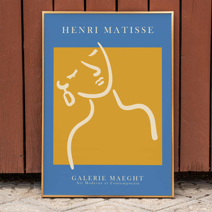 Henri Matisse poster of abstract girl with earring in orange and blue from Galerie Maeght artwork, framed and displayed in home decor