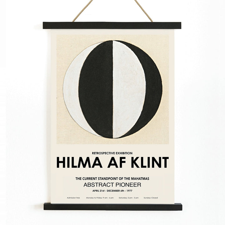 Abstract artwork The Current Standpoint of the Mahatmas by Hilma Af Klint featuring geometric shapes and a black and white abstract circular design poster, with wooden magnetic frame on white background