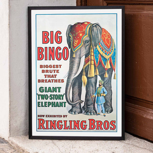 Colorful circus elephant and trainer poster artwork featuring Big Bingo a decorated giant elephant and circus keeper with vibrant circus themed graphics, framed and displayed in home decor