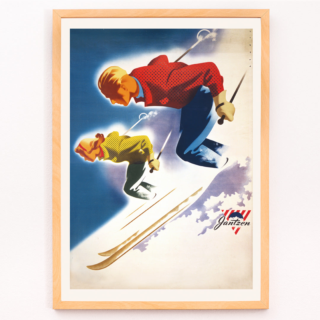 Closeup detail of Vintage skiing poster of man and woman skiing downhill in bold colors by Joseph Binder for Jantzen