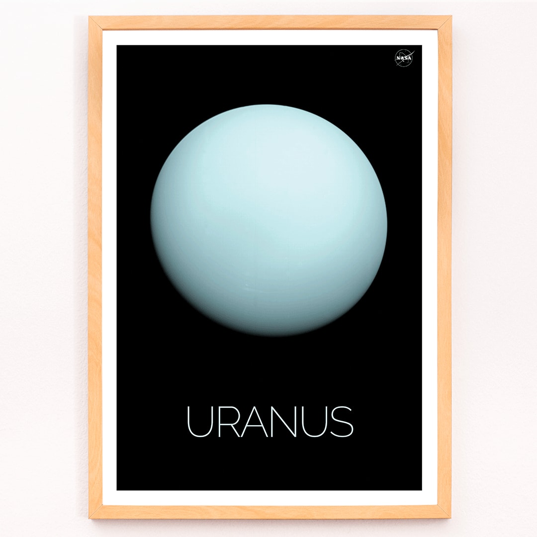 NASA poster of the planet Uranus featuring a light blue sphere against a black background with the title Uranus, framed and displayed in modern living room decor