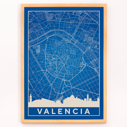 Minimalist Valencia Map poster by artist Minimalist featuring a detailed blue and white city map and skyline, framed and displayed in modern living room decor