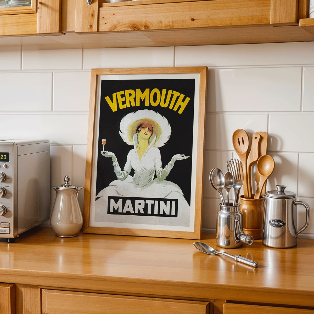 Vermouth Martini by Marcello Dudovich vintage poster art featuring an elegant woman in white holding a glass against a black background, framed and displayed in modern living room decor