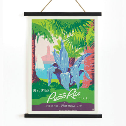 Discover Puerto Rico travel poster by WPA featuring vibrant tropical scenery tropical plants a sailboat and a historic fort in colorful art, with wooden magnetic frame on white background