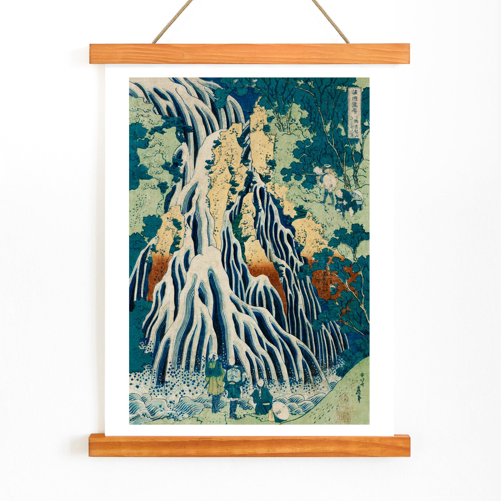 Dramatic waterfall with figures in lush forest landscape Shimotsuke Kurokami Yama Kurifuri no Taki by Katsushika Hokusai poster, with wooden magnetic frame on white background