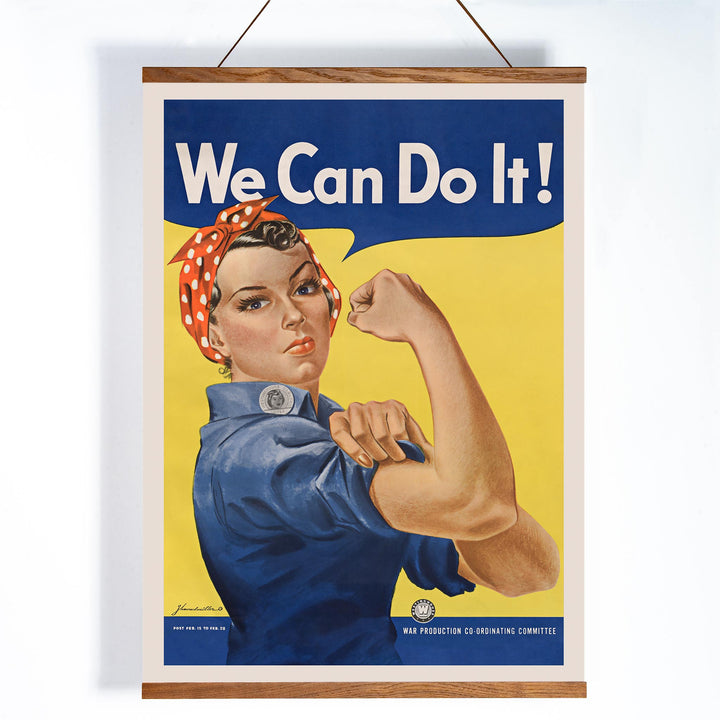 We Can Do It poster by J Howard Miller with determined woman flexing arm in blue and yellow wartime style, with wooden magnetic frame on white background