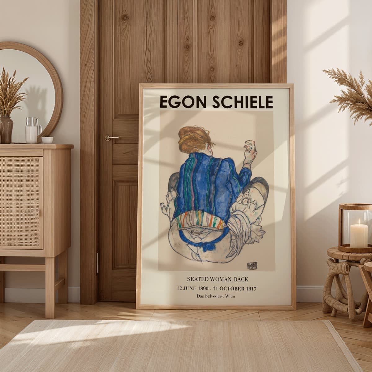 Egon Schiele Woman Seated Back exhibition poster showing a woman in a colorful garment sitting with her back turned artwork, framed and displayed in home decor