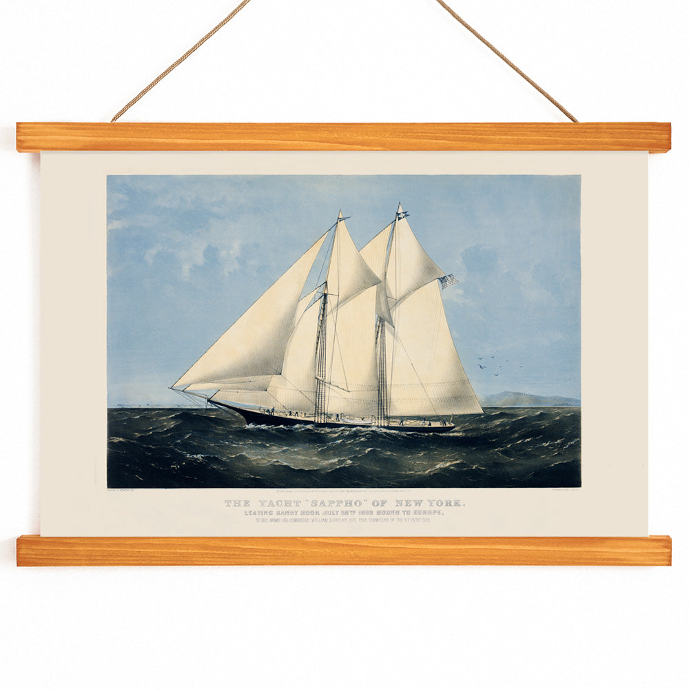 Chromolithograph artwork of Yacht Sappho sailing on the ocean by Currier and Ives poster showing sailing yacht at sea titled Chromolithograph of the yacht Sappho of New York, with wooden magnetic frame on white background